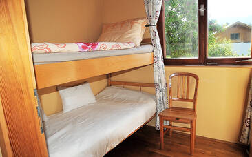 Schlafzimmer mit Stockbetten im Ferienhaus
